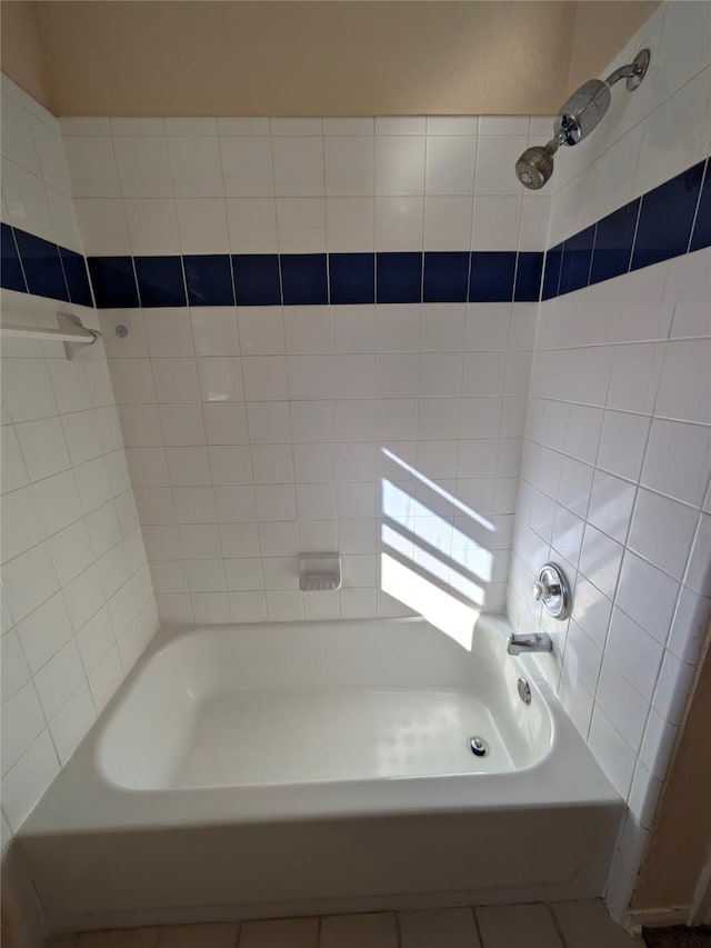 bathroom featuring tile patterned flooring and tub / shower combination