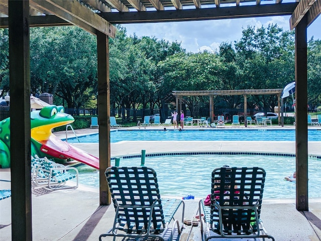 view of swimming pool featuring a pergola