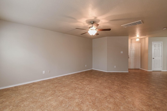 spare room with ceiling fan and a textured ceiling