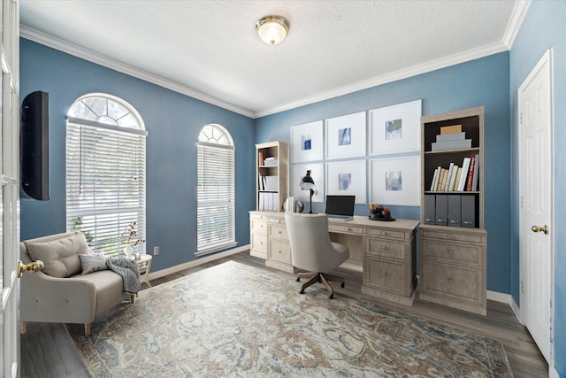 home office featuring dark wood-type flooring, a textured ceiling, and ornamental molding