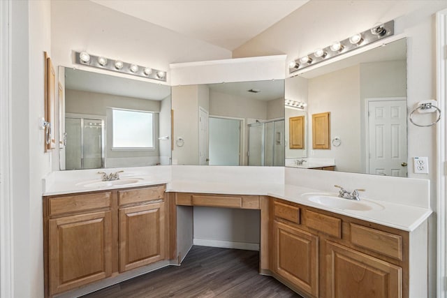 bathroom with vanity, an enclosed shower, wood-type flooring, and lofted ceiling