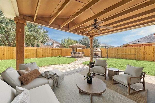 view of patio featuring an outdoor living space and ceiling fan