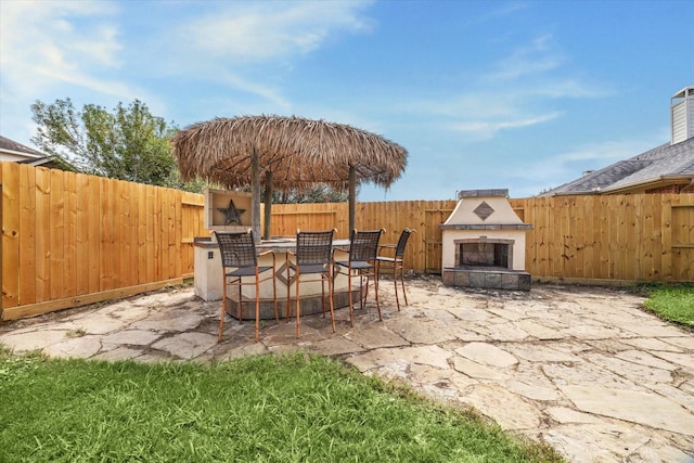 view of patio with a tiled fireplace