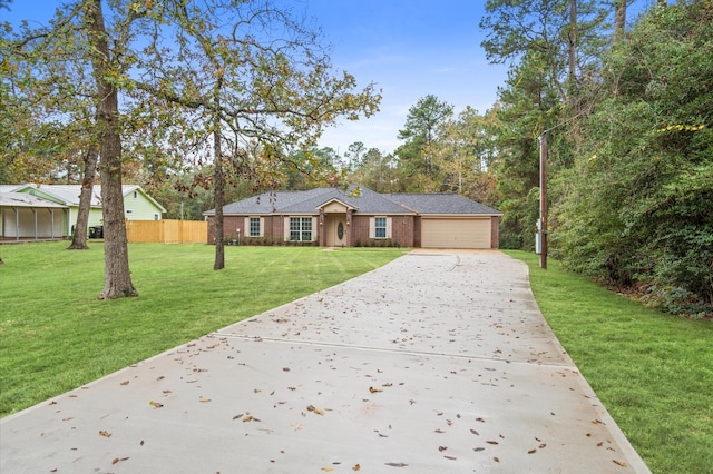 ranch-style home featuring a front yard and a garage