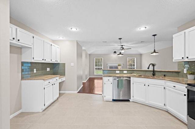 kitchen with dishwasher, decorative light fixtures, white cabinets, and sink