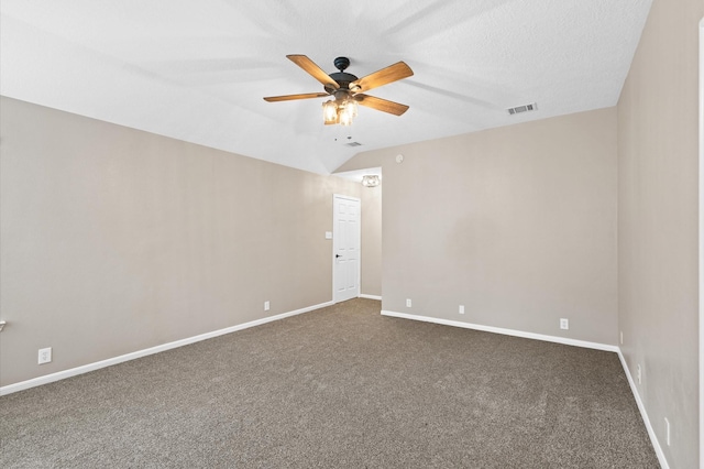 carpeted spare room with a textured ceiling, ceiling fan, and lofted ceiling