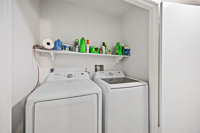 clothes washing area featuring washer and clothes dryer