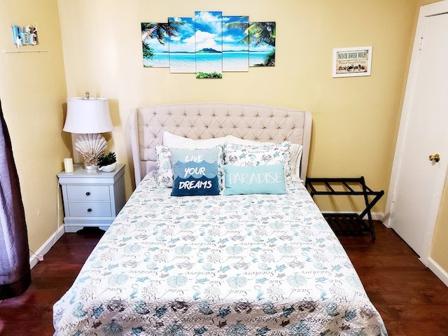 bedroom featuring dark hardwood / wood-style floors