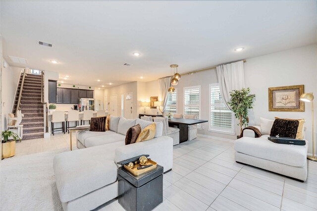 living room with light tile patterned flooring