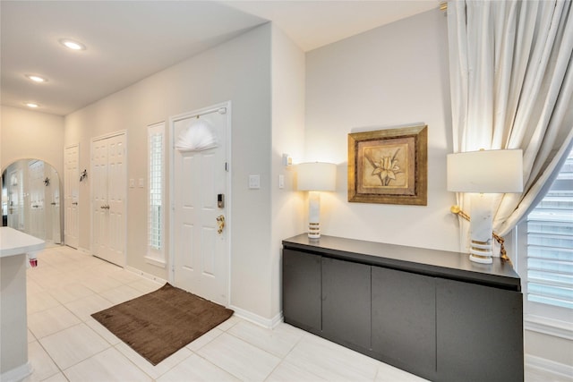 foyer entrance with light tile patterned flooring