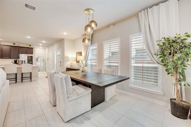 dining room with light tile patterned flooring