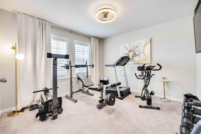 workout room featuring carpet