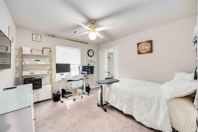 bedroom featuring ceiling fan and light carpet