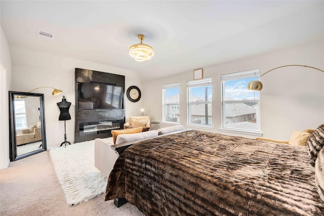 carpeted bedroom featuring vaulted ceiling