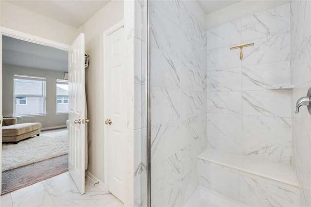 bathroom with tiled shower