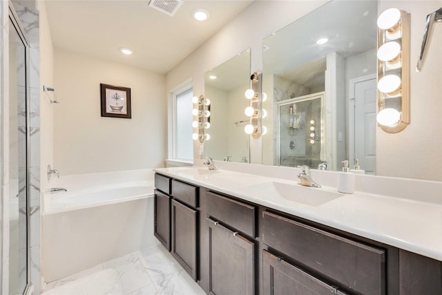 bathroom with vanity and separate shower and tub