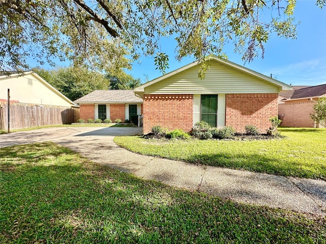 ranch-style home with a front yard