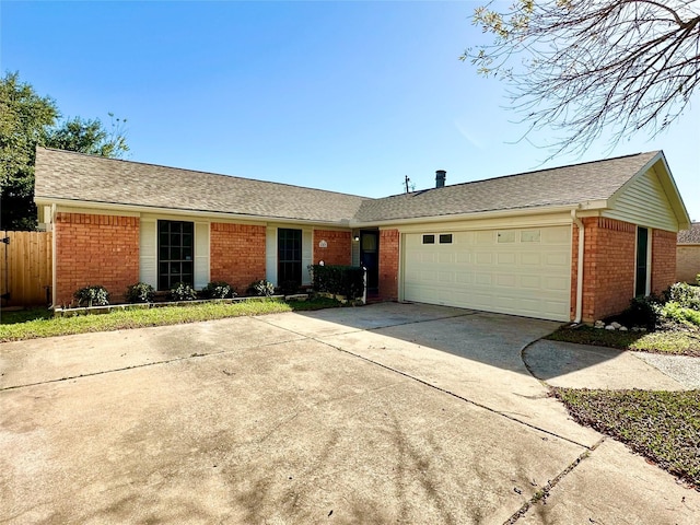 single story home featuring a garage