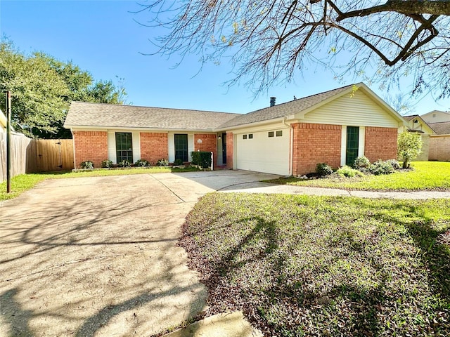 ranch-style home featuring a front lawn and a garage