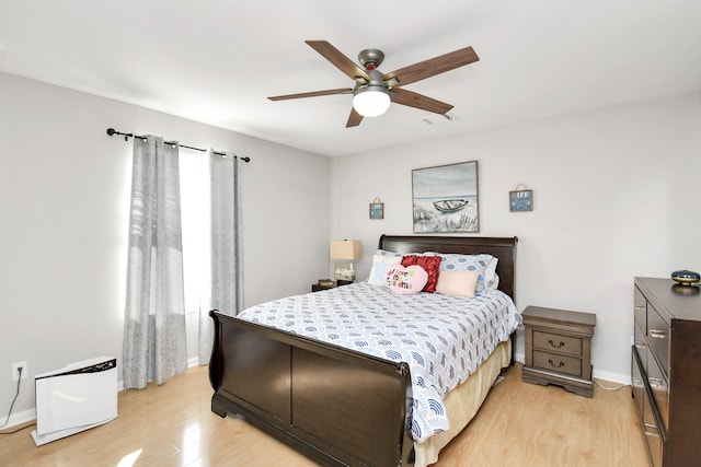 bedroom featuring light wood-type flooring and ceiling fan