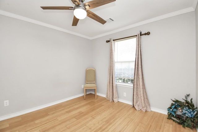 empty room with ceiling fan, light hardwood / wood-style floors, and ornamental molding