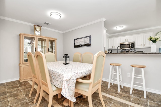 dining area featuring ornamental molding