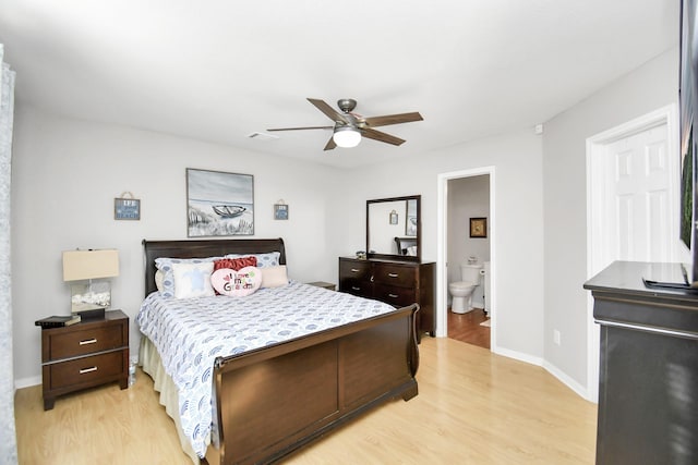 bedroom featuring connected bathroom, light hardwood / wood-style floors, and ceiling fan