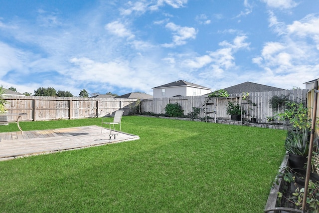 view of yard featuring a wooden deck