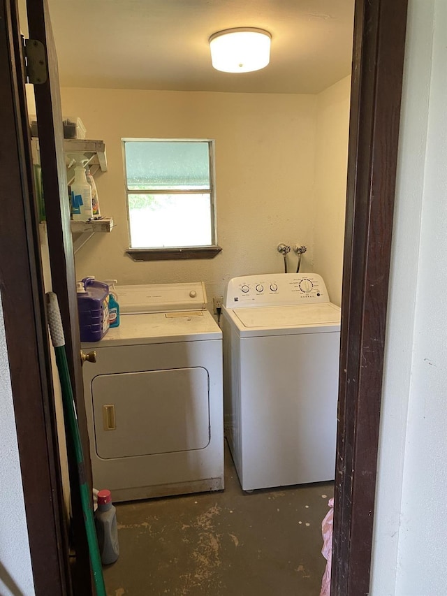 laundry area featuring washer and clothes dryer and laundry area