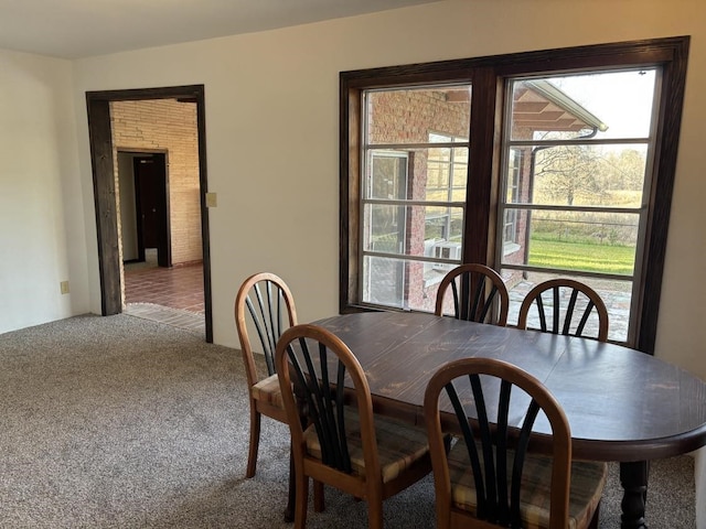 dining space with carpet floors