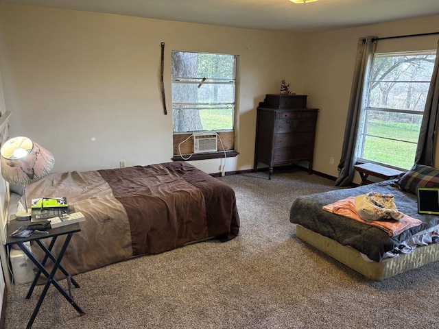 carpeted bedroom with baseboards