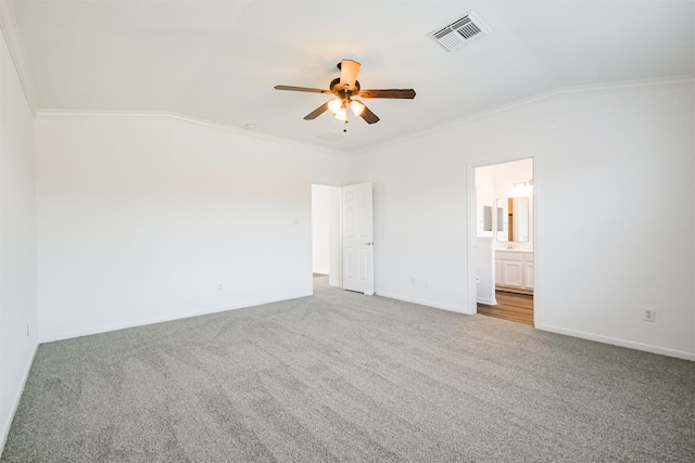 unfurnished bedroom featuring ceiling fan, carpet, vaulted ceiling, and ornamental molding