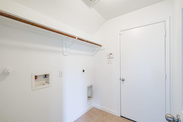 clothes washing area featuring hookup for an electric dryer, light tile patterned floors, and hookup for a washing machine