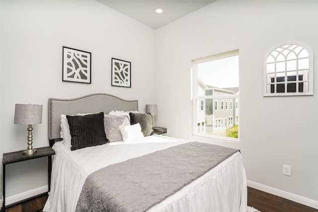 bedroom featuring dark hardwood / wood-style flooring