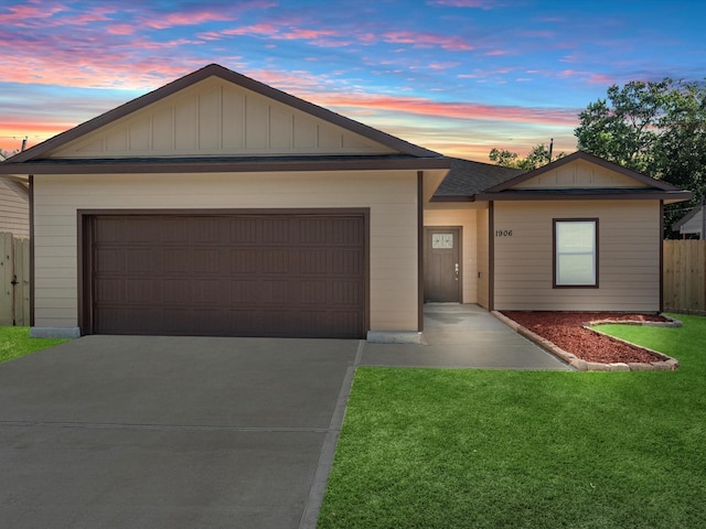 ranch-style home with a lawn and a garage