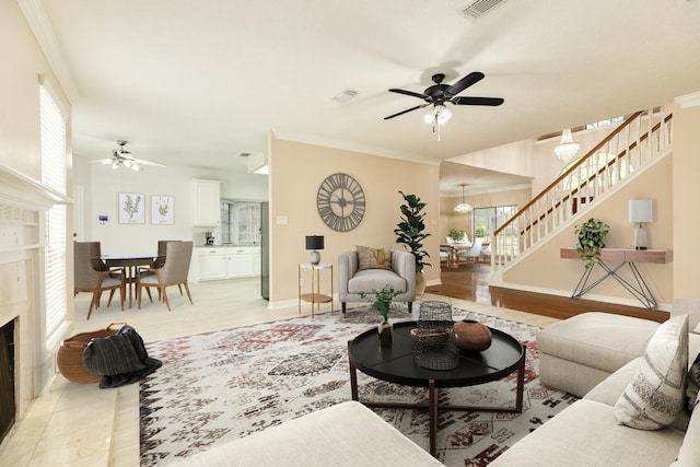 living room featuring a wealth of natural light, a fireplace, and light hardwood / wood-style flooring