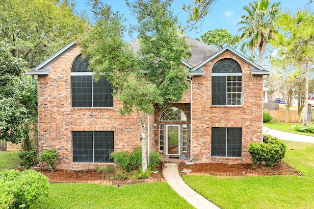 front facade with a front lawn