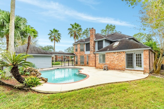 view of swimming pool with a lawn and a patio