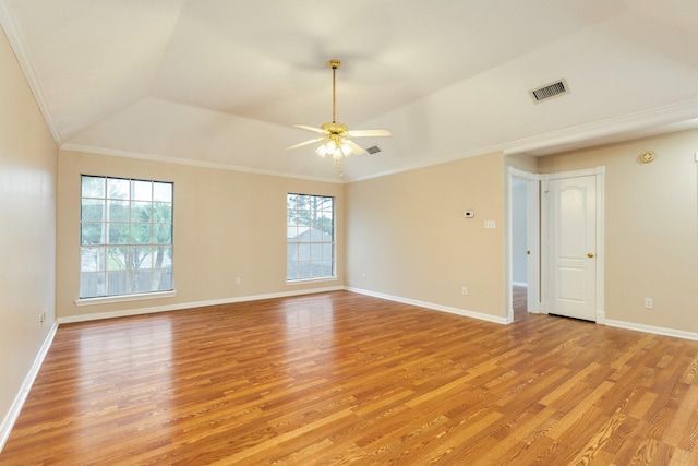 spare room with ceiling fan, light hardwood / wood-style floors, vaulted ceiling, and ornamental molding