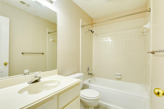 full bathroom with vanity, toilet, and tiled shower / bath