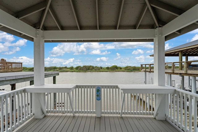 dock area with a gazebo and a water view