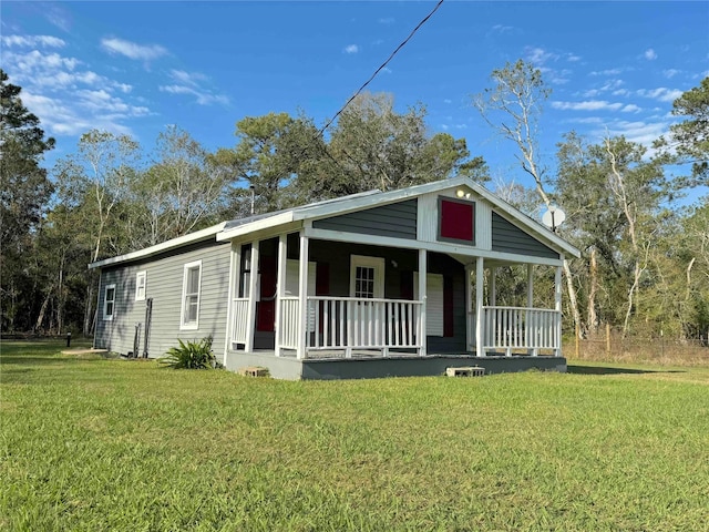 view of front of home with a porch and a front yard