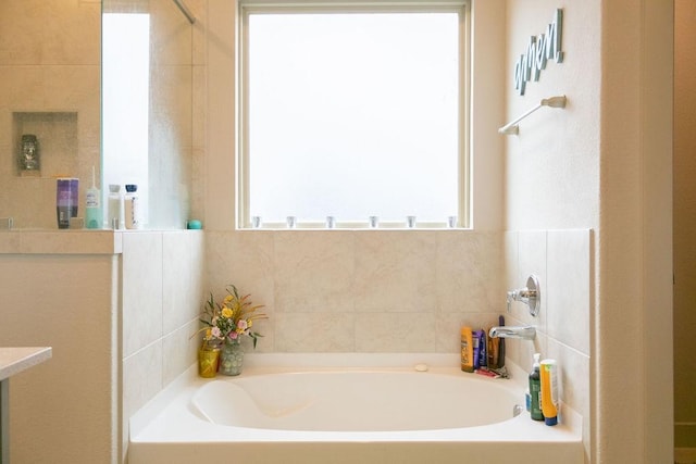 bathroom featuring a tub to relax in