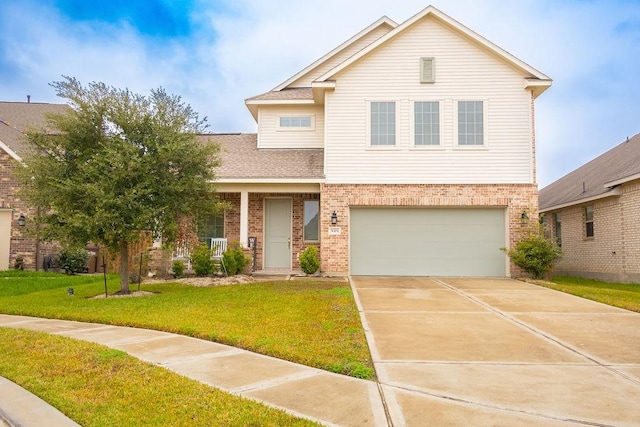 view of front of house featuring a front yard and a garage