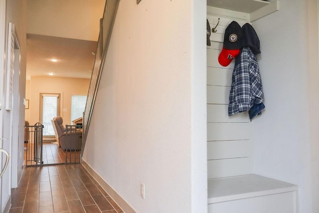 corridor with dark hardwood / wood-style floors