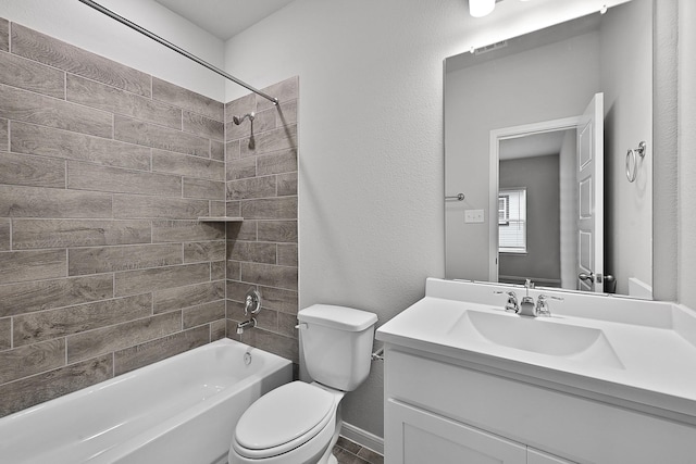 full bathroom featuring tiled shower / bath combo, toilet, and vanity