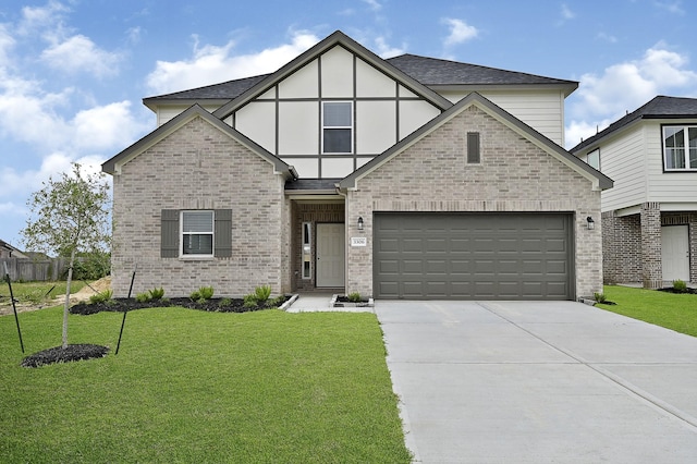 view of front of property featuring a garage and a front lawn