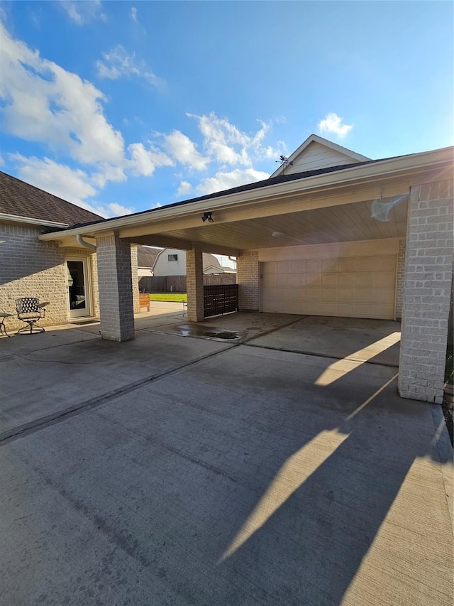 view of parking / parking lot featuring a carport