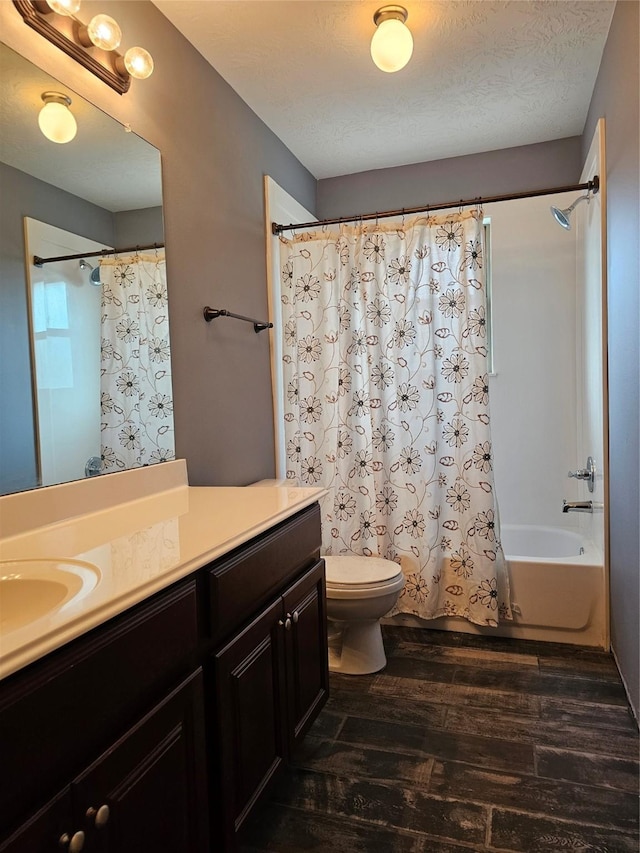 full bathroom featuring a textured ceiling, toilet, vanity, shower / tub combo, and hardwood / wood-style flooring