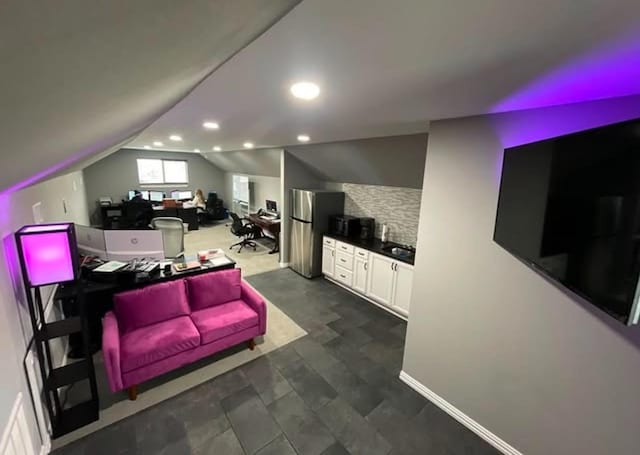 living room featuring vaulted ceiling